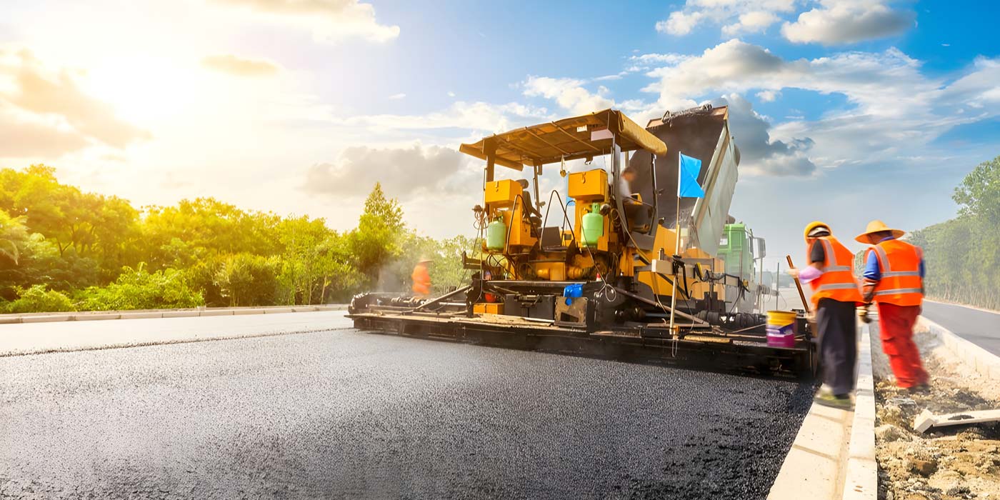 asphalt paver on road bridge construction industry insights in Indonesia