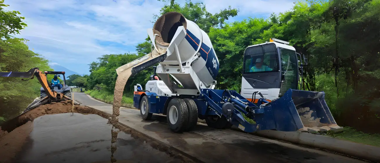 self loading mixer producing concrete on site for road building in Indonesia
